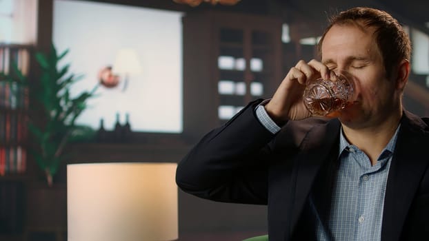 Classy high society member enjoying a glass of whiskey bourbon in a private social club, emphasizing the sophisticated upper class lifestyle and entertainment. Old money luxury. Camera A.