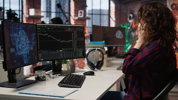 Startup manager delighted by successful IPO, watching live market updates showing stocks raising. Venture team leader happy after becoming publicly traded company, giving good news to team, camera A
