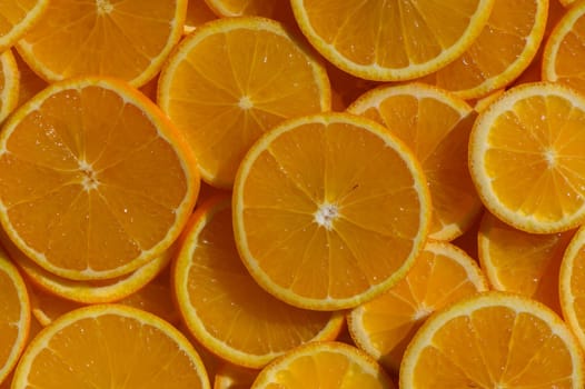 Bright and juicy orange slices are artfully arranged on a wooden surface, radiating summer vibes. The golden hues invite a refreshing feel, inspiring delightful recipes.