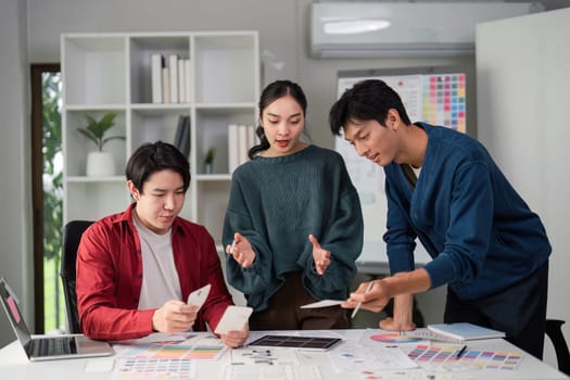 Professionals share ideas and feedback on UX designs, focused on creating user-friendly interfaces in an inviting and creative atmosphere.