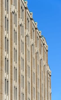 Fron side of the historic office building in downtown of Vancouver on blue sky background.