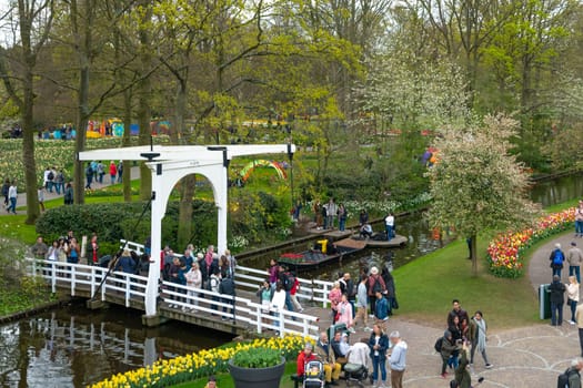 Lisse, Netherlands - April 17, 2019: Numerous people walk in a Keukenhof park View from above