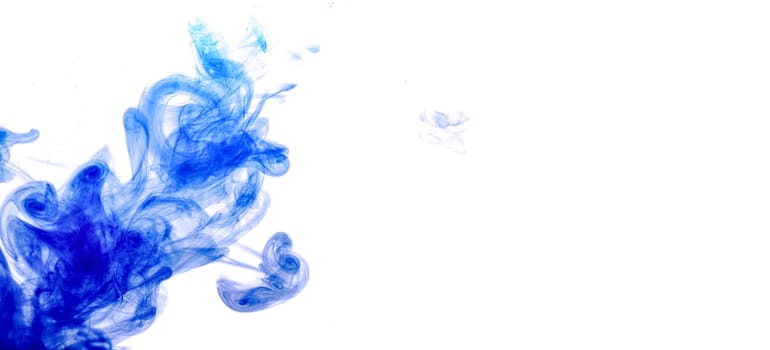 Blue ink injected into water from syringe, colour mixing with water creating abstract shapes, banner with space for text right side