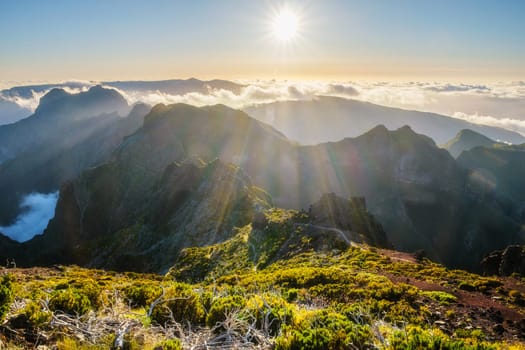 View of mountains over clouds from Pico Ruivo on sunset. Madeira island, Portugal