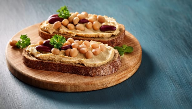 sliced bread with hummus and bean spread topping AI generated image