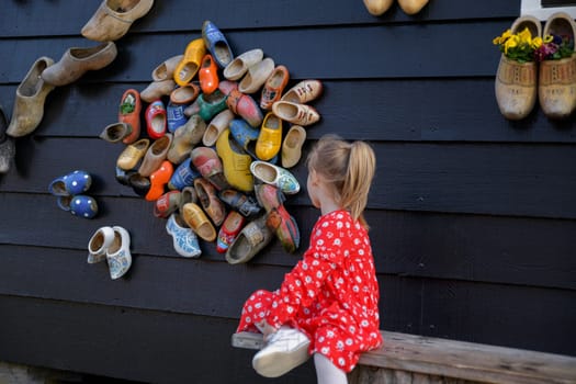 ZAANSE SCHANS, NETHERLANDS - APRIL 18, 2019: Dutch wooden clog on the wall. Wooden Shoes museum.