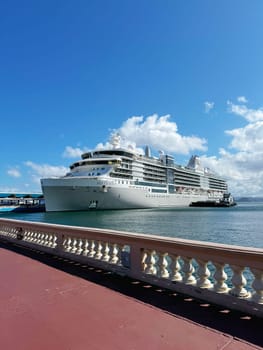 Puerto Rico, San Juan November 22. 2023 The luxury cruise ship Silver Nova is docked at the port, under a clear blue tropical sky