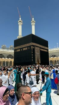 MECCA, SAUDI ARABIA - MAY 02 2024: View on Kaaba from second floor of Masjid Al Haram through some new constructions building around the masjid. High quality photo
