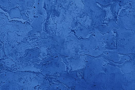Abstract decorative dark blue plaster wall background