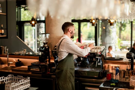 Dedicated barista expertly prepares espresso while engaging with a lively atmosphere filled with sunlight, plants, and happy customers savoring their drinks