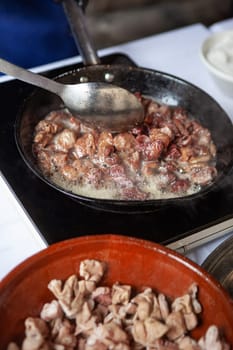 Cooking pork tripe in a frying pan