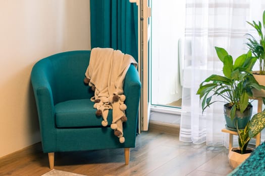 Close up of the cozy corner in the apartment with comfortable arm chair