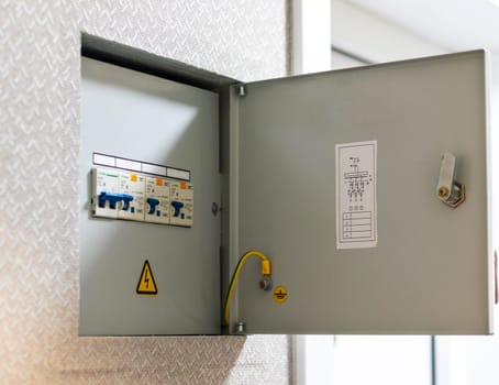 Open electrical switchboard in the apartment