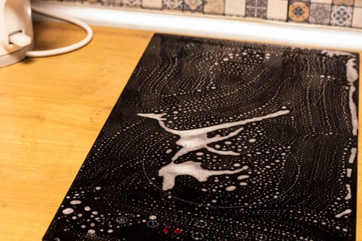 Cleaning solution sprayed on the electrical stove