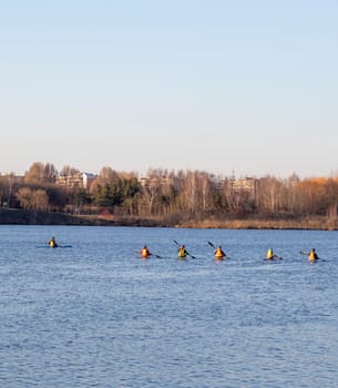 Group of people kayaking on the open water