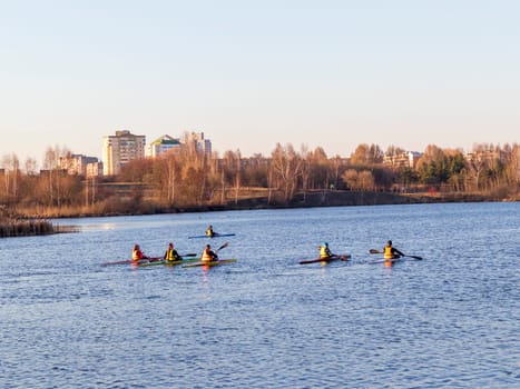 Group of people kayaking on the open water