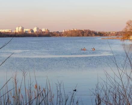 Group of people kayaking on the open water