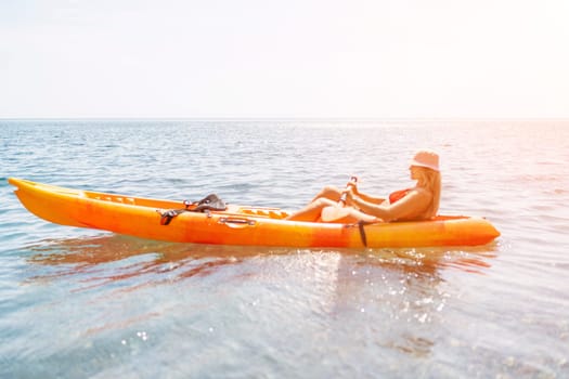 Kayak sea woman. Happy attractive woman with long hair in red swimsuit, swimming on kayak. Summer holiday vacation and travel concept