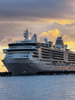 Puerto Rico, San Juan November 22. 2023 Elegant cruise ship Silver Nova docked at port during golden sunset, showcasing maritime travel, leisure tourism, and ocean adventure.