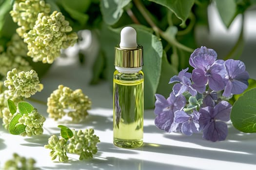 A small glass bottle filled with golden oil is placed among lush green leaves and colorful flowers, creating a serene and aromatic atmosphere in bright light.