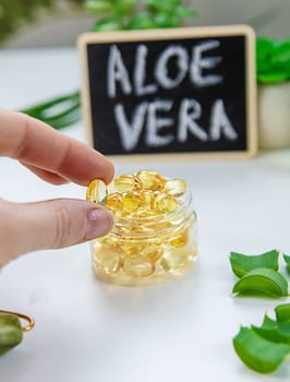 Aloe vera capsules and extract drops. Selective focus. nature.