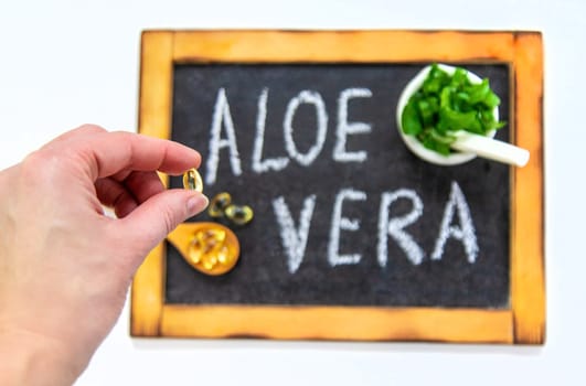 Aloe vera capsules and extract drops. Selective focus. nature.