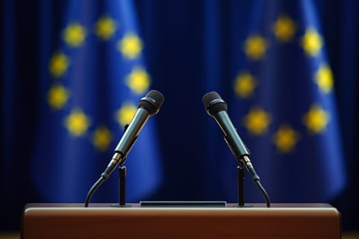 Wooden podium with two microphones against EU flag backdrop. Platform for speech presentation at government press conference, politic debates..