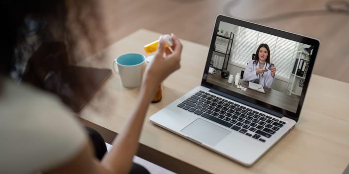 During a telemedicine session, a healthcare professional provides tailored advice on medication usage to a patient at home, ensuring safety and wellness.