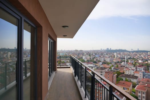 Balcony offers a panoramic view of urban architecture and skyline.