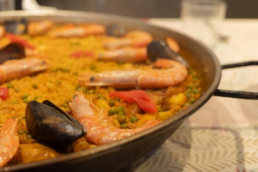 A vibrant seafood paella featuring succulent shrimp and mussels, showcasing a colorful mix of fresh ingredients and a perfect blend of spices, representing a culinary delight.