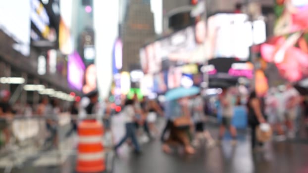 New York City, United States - 10 Sept 2023: Times Square Manhattan Midtown Broadway street, USA. Defocused people pedestrians, zebra crosswalk. NYC urban road traffic. Commercial billboard screens.