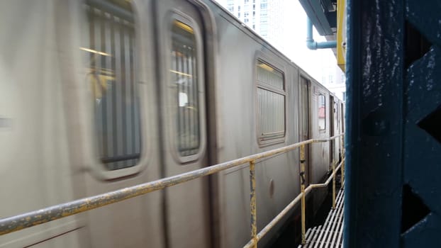New York City, United States - 29 August 2023: Subway station. Metro train on public transportation platform. Elevated outdoor Court Square railway, Queens. NYC passenger railroad traffic, Long Island