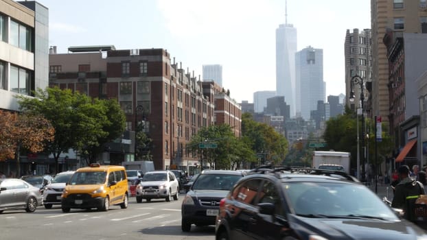 New York City, United States - 10 Sept 2023: Manhattan Greenwich Village street, Sixth 6 Americas avenue crossroad. Urban road car traffic in USA. People, zebra, yellow taxi cab. World trade center.