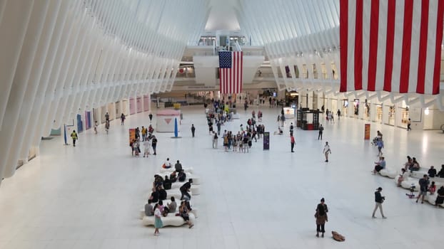 New York City, United States - 10 Sept 2023: World Trade Center Oculus transport hub architecture. Manhattan Downtown Financial District, USA urban life. People. September 11 remembrance american flag