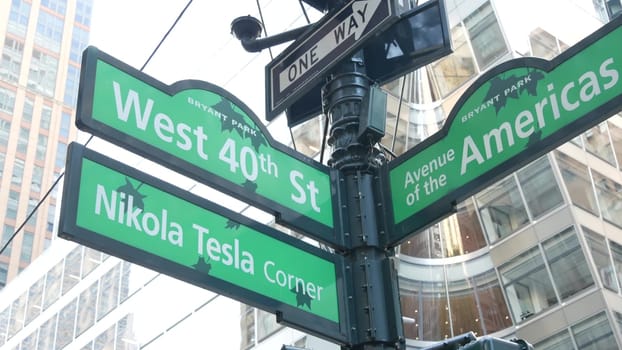 New York City, United States - 5 Sept 2023: Crossroad street intersection road sign. 6 Sixth ave, Americas avenue corner, Midtown business district. High-rise skyscraper architecture, text roadsign.