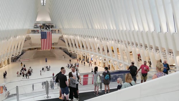 New York City, United States - 10 Sept 2023: World Trade Center Oculus transport hub architecture. Manhattan Downtown Financial District, USA urban life. People. September 11 remembrance american flag