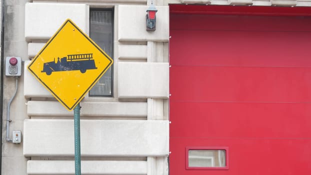New York City, United States - 30 Aug 2023: NYFD sign, USA fire department truck, american firefighters vehicle or NYC fire fighter engine. Firemen station red gates, FD house or hall. Queens street.
