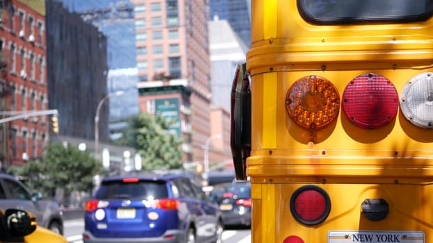 New York City, United States - 1 Sept 2023: Yellow School Bus, Manhattan street, schoolbus truck. Children education and road transportation, USA. American school shuttle. Taxi cab, 10 avenue Chelsea.