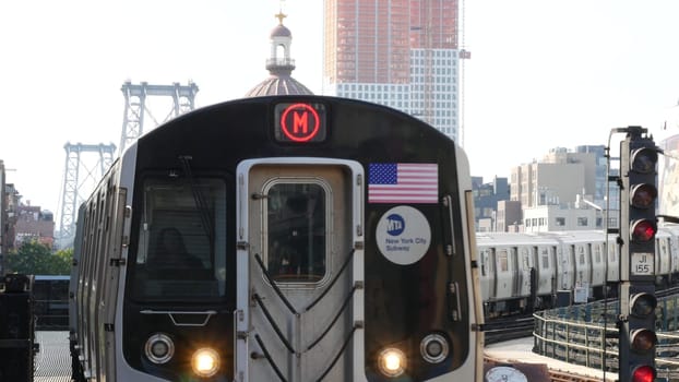 New York City, United States - 7 Sept 2023: Subway station. Metro train, public transportation platform. Elevated outdoor NYC railway Marcy Av, Brooklyn passenger railroad traffic, Williamsburg Bridge
