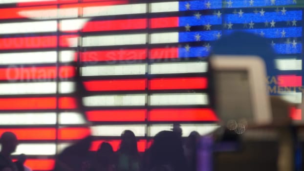New York City, United States - 5 Sept 2023: Times Square, Manhattan Midtown Broadway street, USA. American flag, NYC urban life. Military island, army recruiting. People pedestrians silhouettes, crowd