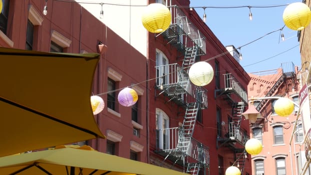 New York City, United States - 14 Sept 2023: Manhattan Chinatown Doyers street, chinese ethnic district building architecture, USA. Brick houses, paper lanterns, little China town. Fire escape ladder.