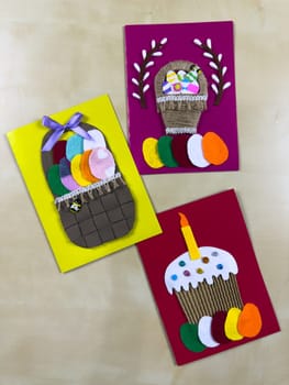 Charming trio of handmade Easter cards features delightful basket filled with colorful felt eggs and festive cake with candle. Perfect for spreading joy and warm wishes during Easter celebrations
