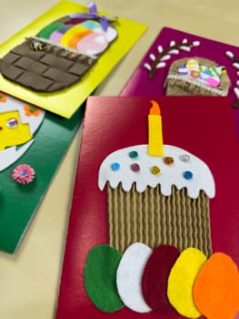 This whimsical assortment of handmade Easter cards features a colorful cake with a candle and charming baskets filled with felt eggs. Ideal for spreading joy and festive greetings