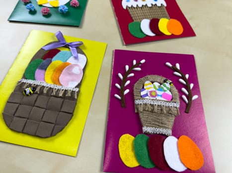 Charming collection of handmade Easter cards features colorful baskets filled with felt eggs and a festive cake. Ideal for sharing joy and warm wishes during Easter festivities