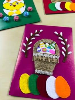 Collection of handmade Easter cards featuring vibrant and colorful decorations. Each card is uniquely designed with felt, yarn, and paper cutouts, perfect for celebrating the Easter holiday