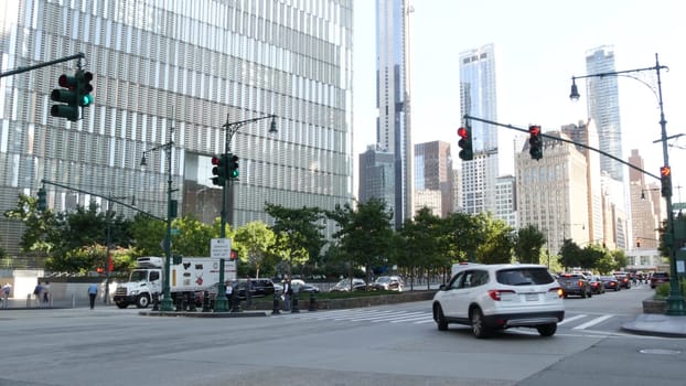 New York City, United States - 31 Aug 2023: Manhattan Downtown Financial District street crossroad intersection. Urban road car traffic. People pedestrian. World Trade Center memorial area.