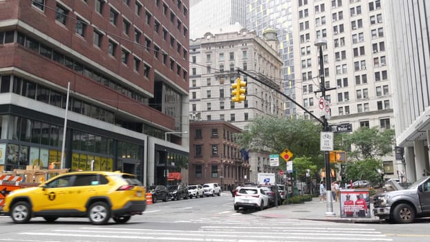 New York City, United States - 9 Sept 2023: Manhattan Downtown Financial District Water street crossroad intersection. USA NY city life. Urban road car traffic. Yellow taxi. People pedestrian, zebra.
