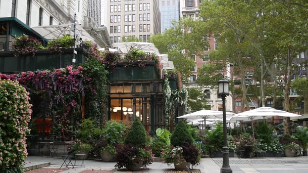 New York City, United States - 13 Sept 2023: Manhattan Midtown Bryant Park with Public library, 42 street and 5th Fifth 5 avenue. USA landmark. Summer cafe greenery, garden flowers bloom and building.