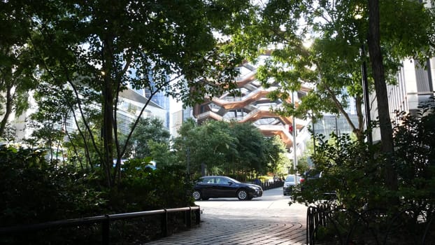 New York City, United States - 1 Sept 2023: Hudson Yards Vessel, urban architecture in Chelsea, Manhattan Midtown 34 street, USA. New modern glass skyscrapers, american business buildings, real estate