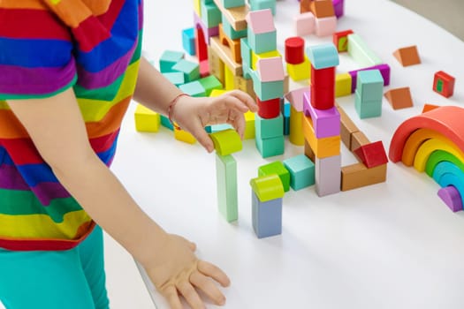 A child builds from blocks. Selective focus. kid.